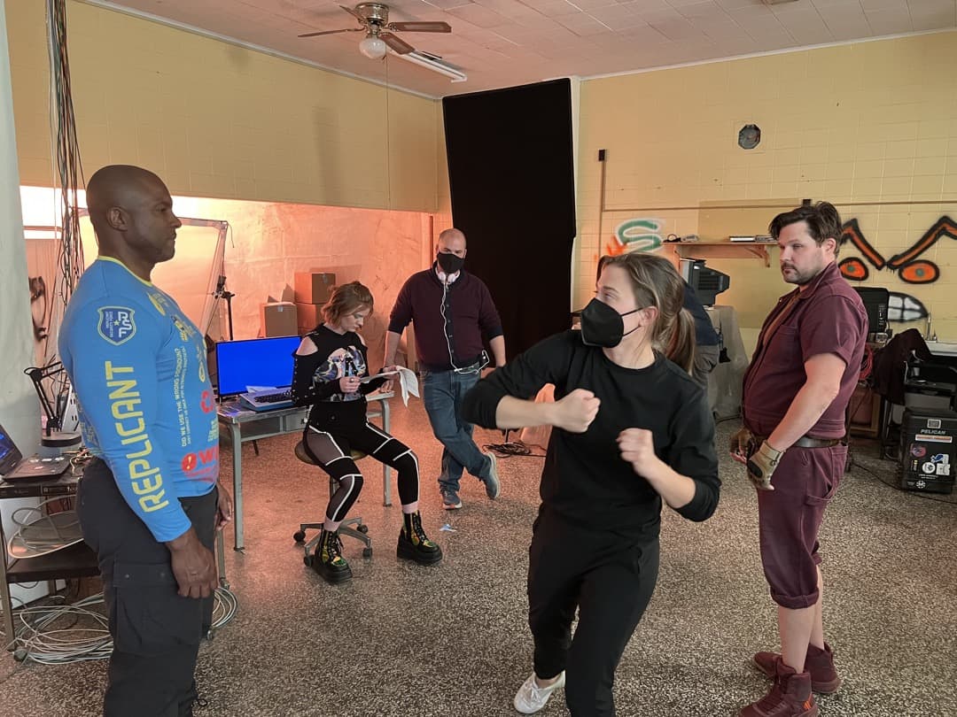 Behind the scenes photo 36 from Clone Cops production showing stunt coordinator juliene joyner prepares a fight sequence with dion harris and ted welch